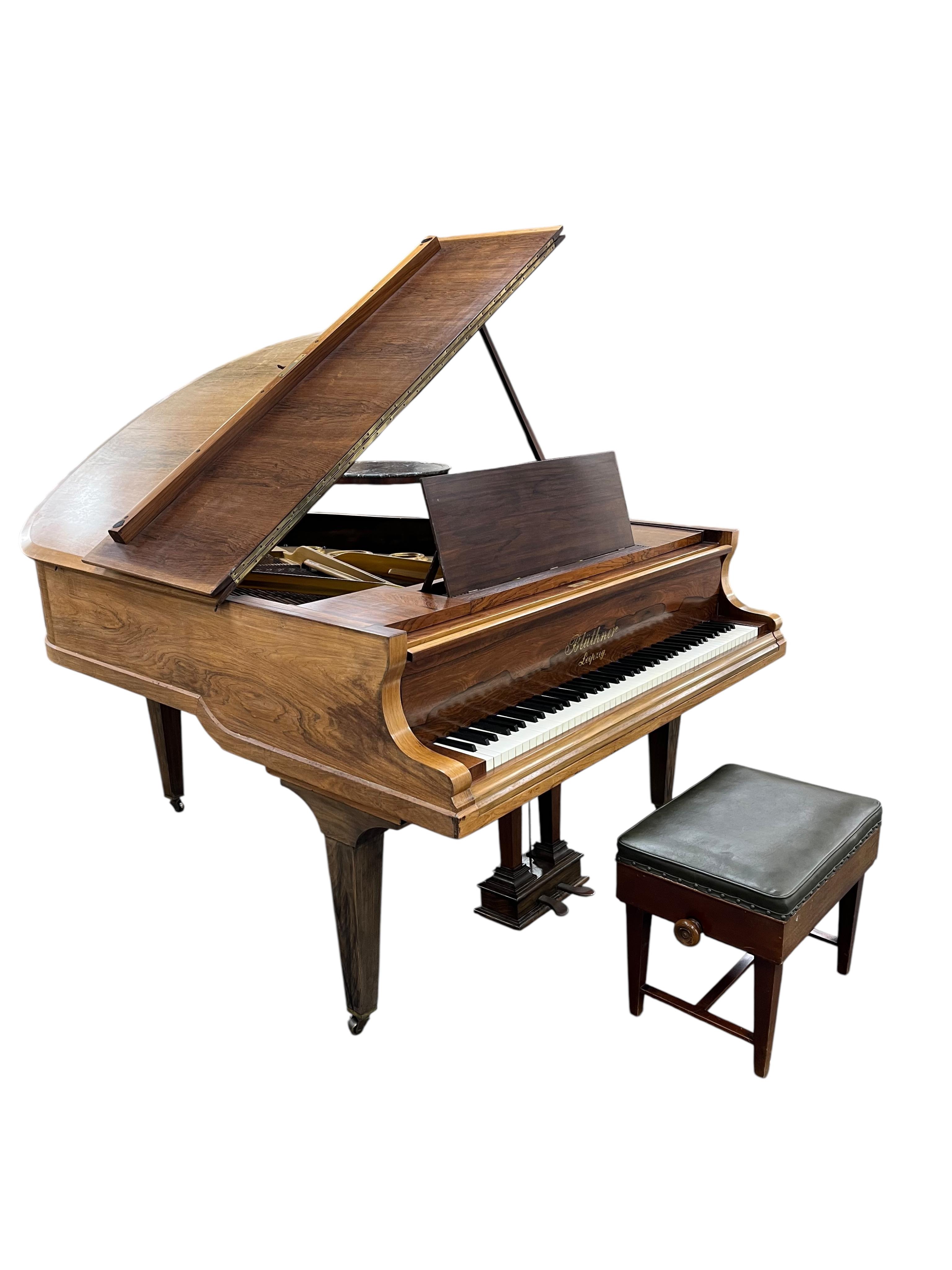 A Bluthner faded rosewood baby grand piano circa 1914, 176cm together with an adjustable piano stool. CITES Submission reference HWK4RNUW